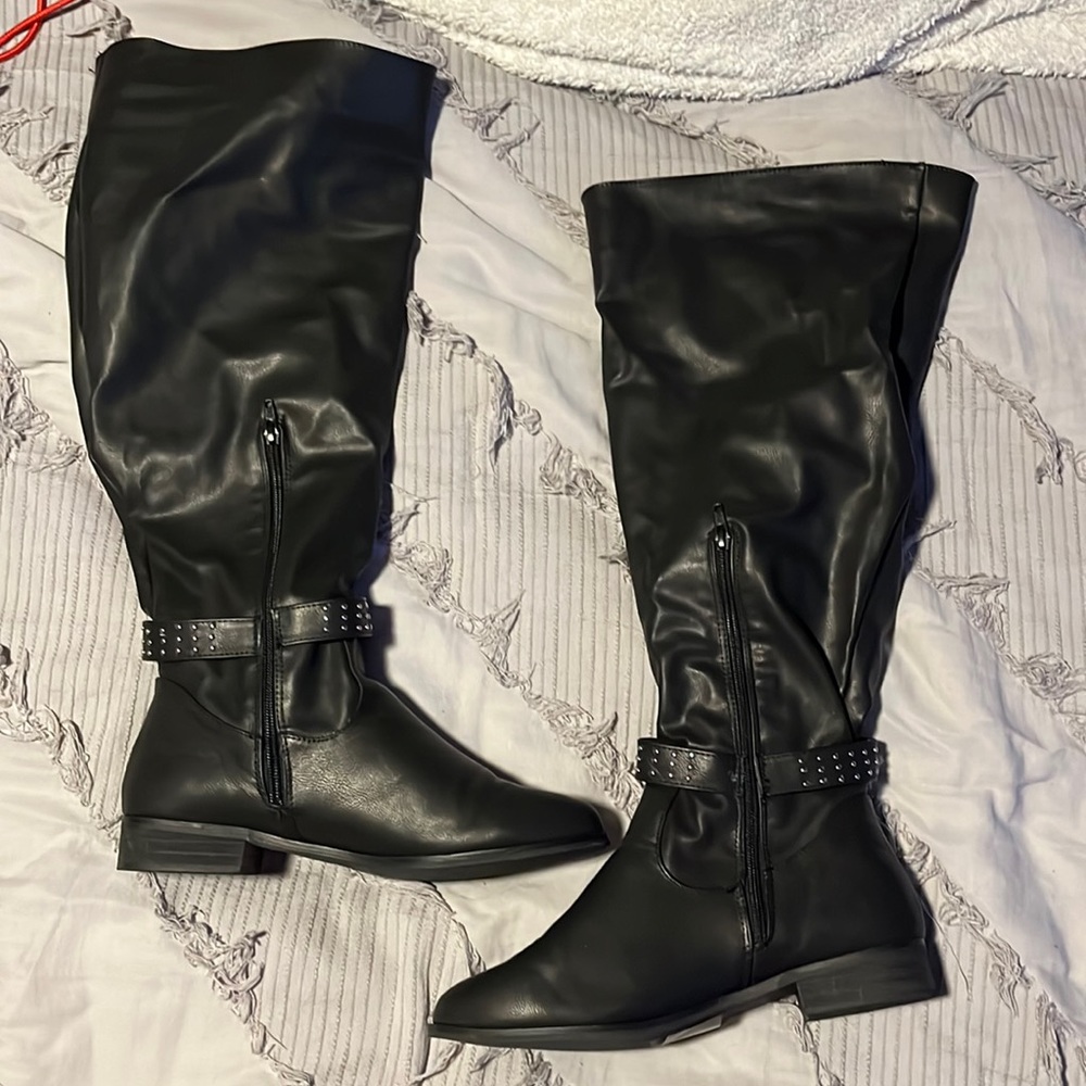 Knee high black boots with belt detail